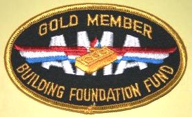 To encourage monetary donations towards the building costs. several levels of donation to the building fund were set up and donor received various items at each level. This patch indicated that the donor had given at the Gold level, or the highest level towards the building fund. (Source: National Model Aviation Museum Collection, AMA Collection, 2005.02.101.)